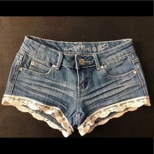 Lace trimmed denim shorts
